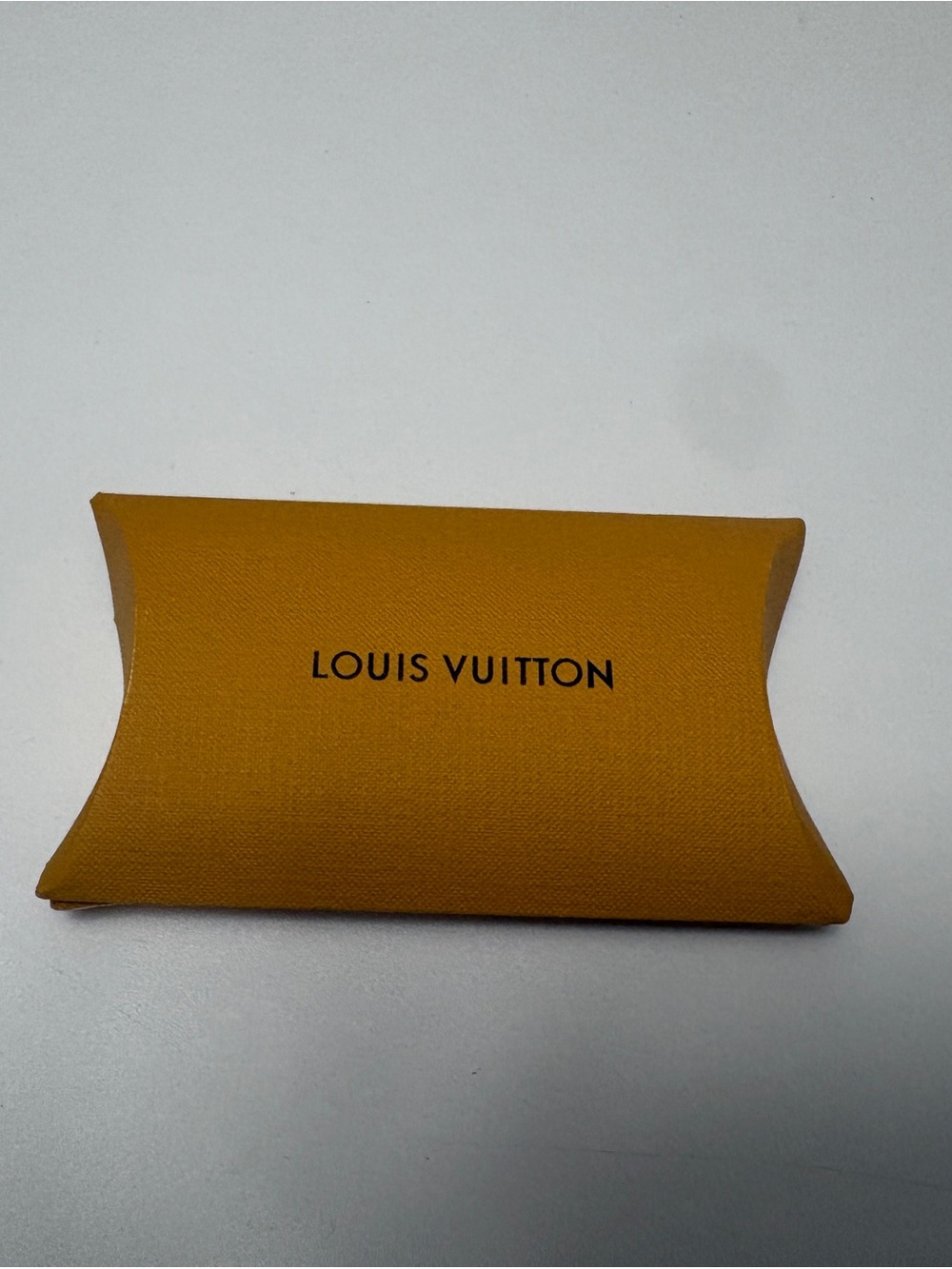 Louis Vuitton shoelace sleeve and white original shoe laces. (New)